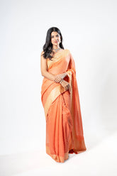 Pure Khaddi Georgette peach colour handloom Saree with woven booty all over