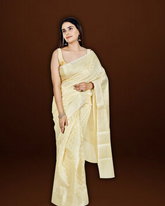 Serene Splendor: Cream Banarasi Cotton Saree with Beautiful Motif Border