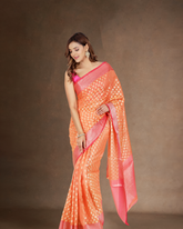 Vibrant Harmony: Orange Chanderi Banarasi Saree with Magenta Border