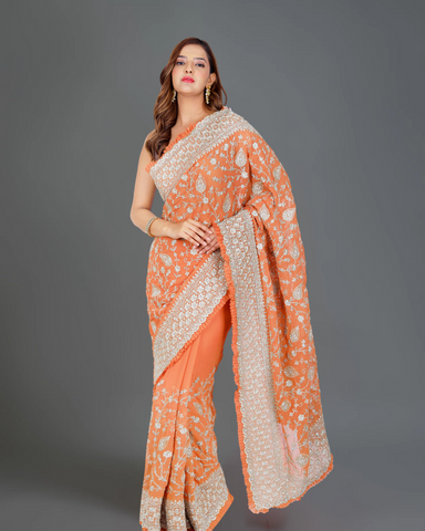Designer Delight: Orange Georgette Saree with Exquisite Embroidery