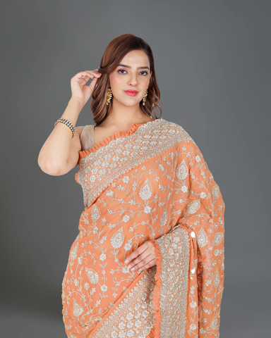 Designer Delight: Orange Georgette Saree with Exquisite Embroidery