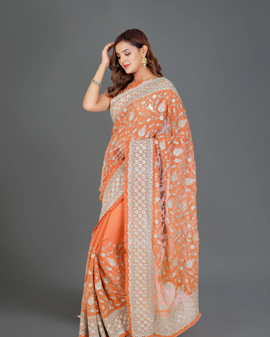 Designer Delight: Orange Georgette Saree with Exquisite Embroidery