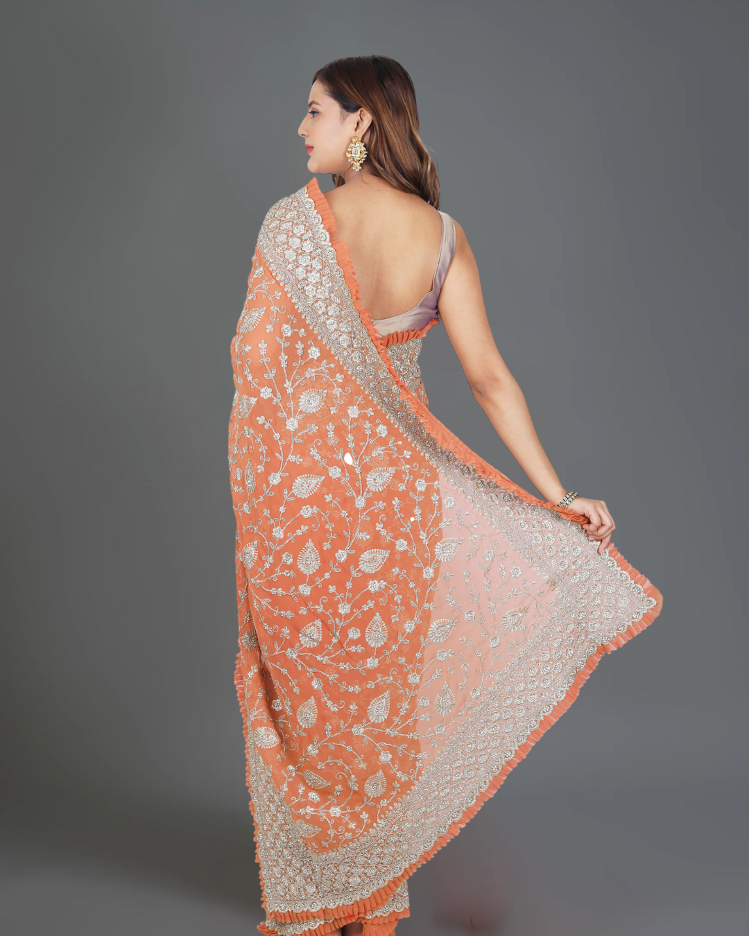 Designer Delight: Orange Georgette Saree with Exquisite Embroidery